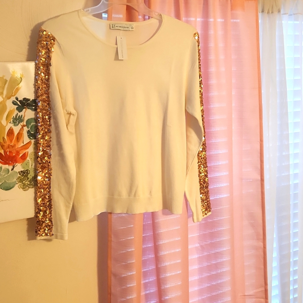 A brand new cream and gold sequence sweater size L by NY&C for $17.